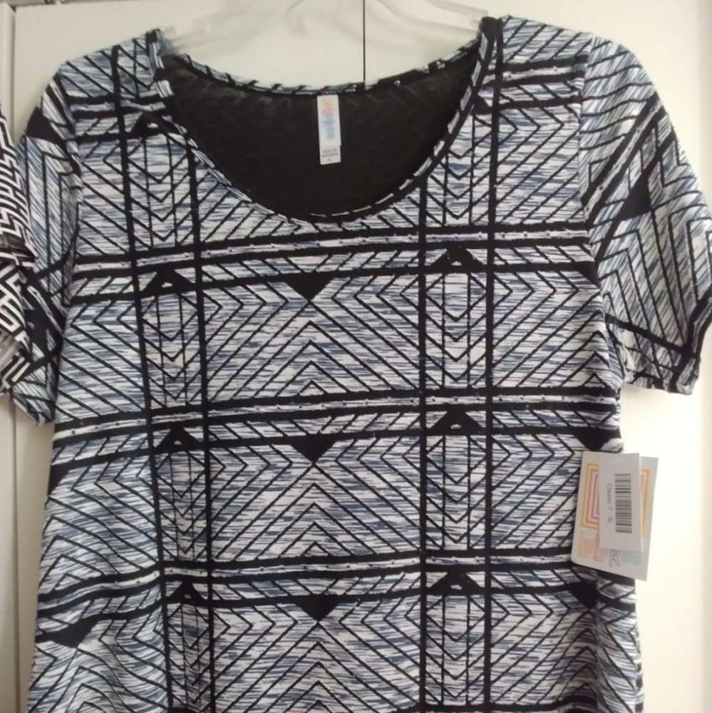 Clothes ranging in sizes large to 2xl